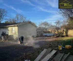 newly installed concrete driveway in front of a modern house