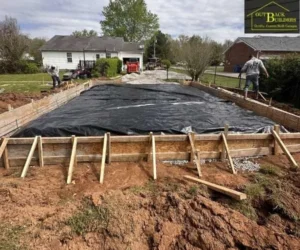concrete pour in a residential yard, referencing concrete sidewalks